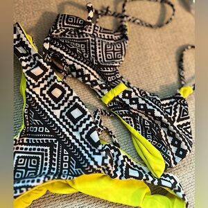 Pair of tribal 2 piece swimsuit from Kaikini Made on Kauai. TOP: SM; BOTTOM: M